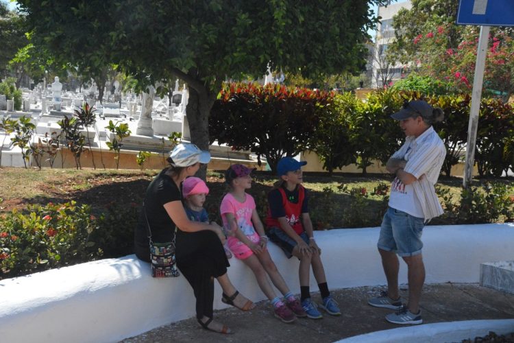 Hanging in the shade at the Old Havana cemetery on our day trip with kids