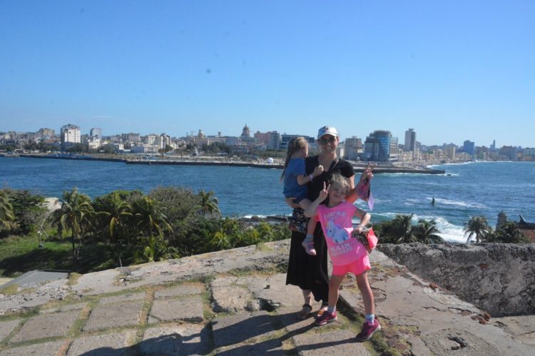 Posing on the Malecon during our Havana tour with kids