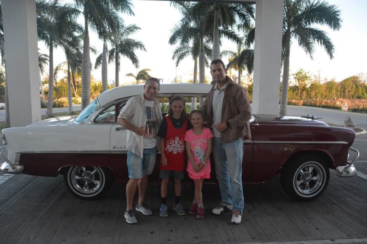 With our vintage car tour guide and driver for our Havana day trip with kids